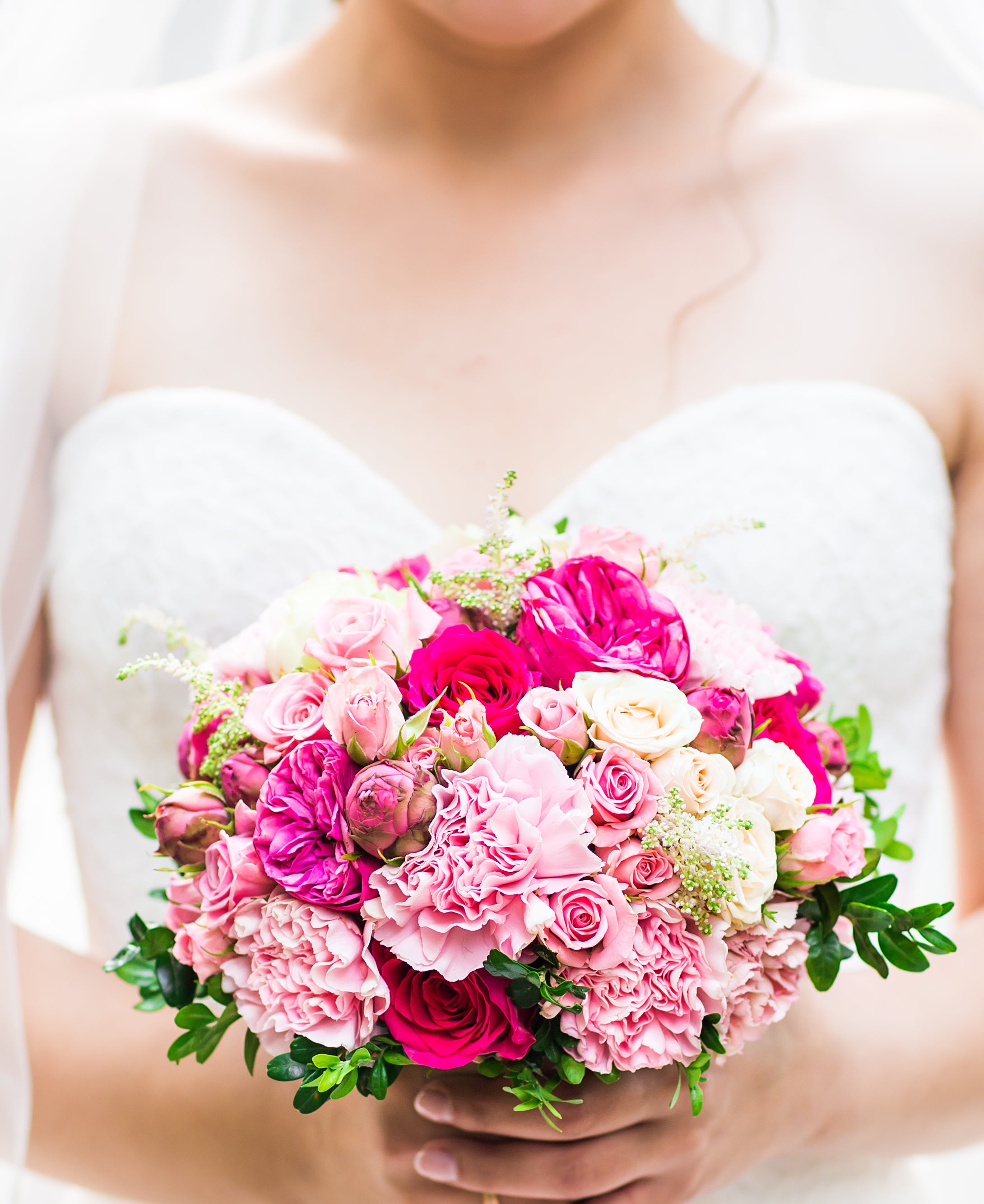 Los Angeles bride holding pink and magenta bouquet by Pearson Floral Designs