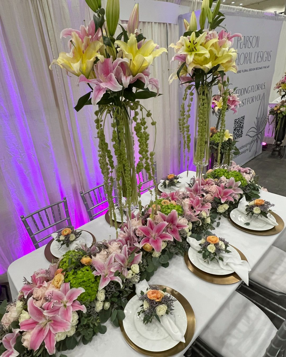 Top view of a floral tablescape featuring stargazer and yellow lilies at the Los Angeles Bridal Expo