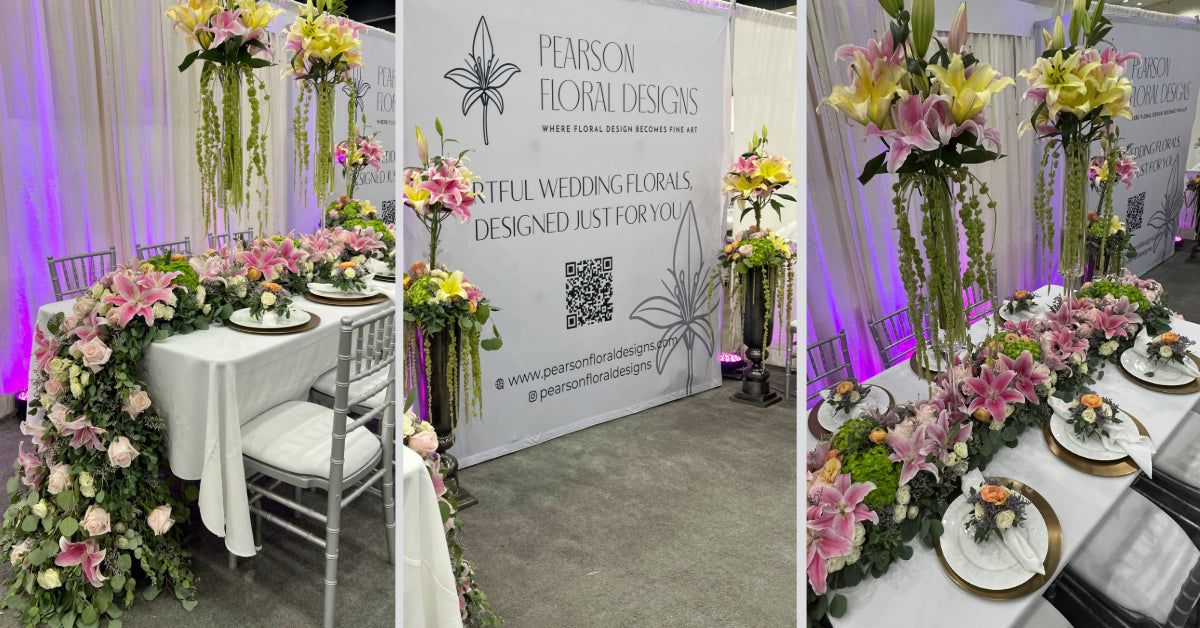 LA Bridal Expo Booth features table runner and statement arrangements with lilies, ranunculus, hydrangeas, and eucalyptus.