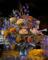 Holiday event florals in blues, orange, peach, silver, and gold tones installed at Avalon Hollywood's bar.