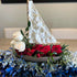 Sailboat-shaped floral tribute testimonial thumbnail by Pearson Floral Designs for a celebration of life in Los Angeles.