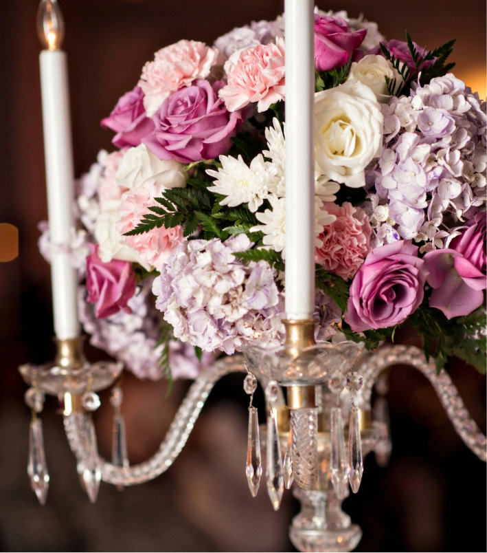 Romantic wedding centerpiece with lavender roses, hydrangea, and candlelight – Los Angeles wedding florist